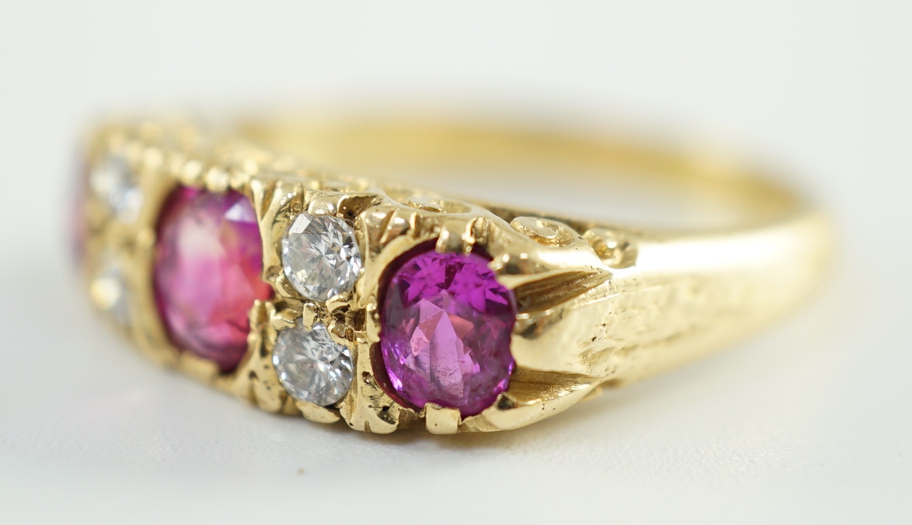 An early to mid 20th century 18ct gold, single stone oval cut ruby, two stone pink sapphire and four - Image 2 of 5