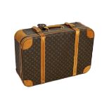 A 1980/90s Louis Vuitton canvas monogram suitcase, with calf leather straps and brass hardware,