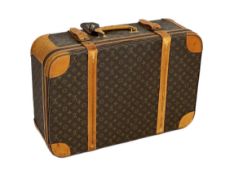 A 1980/90s Louis Vuitton canvas monogram suitcase, with calf leather straps and brass hardware,