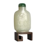 A Chinese white jade snuff bottle, 19th/20th century, carved in relief with a squirrel on rockwork
