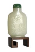A Chinese white jade snuff bottle, 19th/20th century, carved in relief with a squirrel on rockwork
