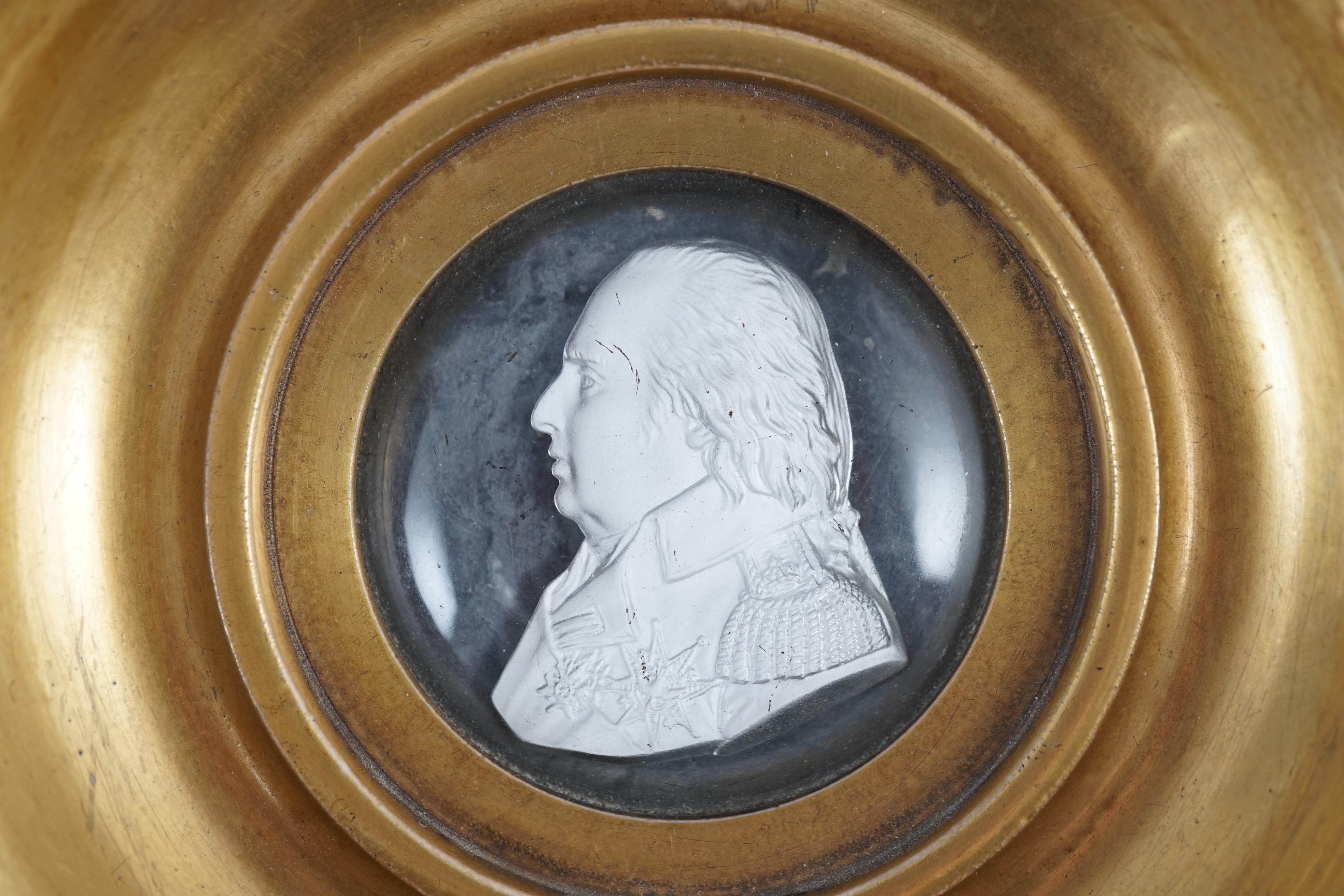 A Louis XVIII glass sulphide portrait plaque, in a gilded porcelain frame, c.1820, the cristallo- - Image 2 of 3