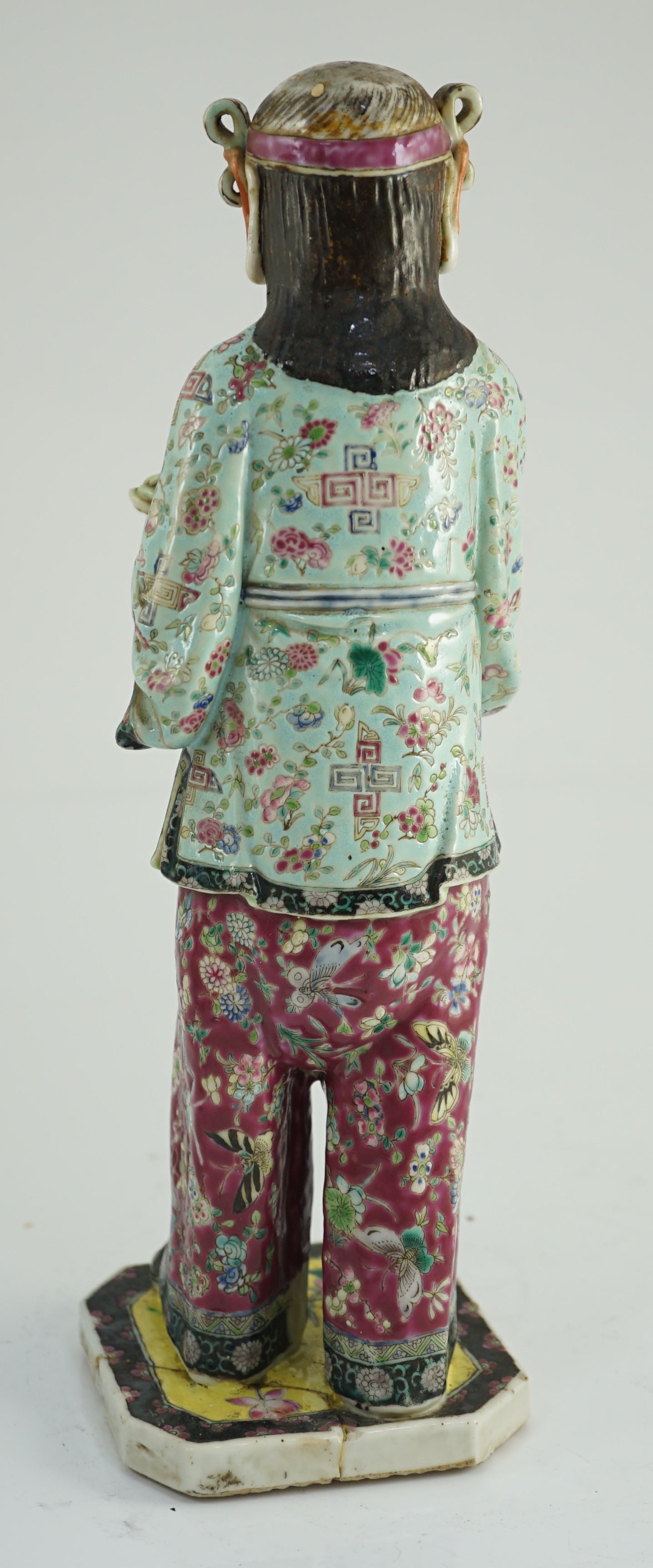 A Chinese enamelled porcelain figure of a boy attendant, early 20th century, the standing figure - Image 2 of 6