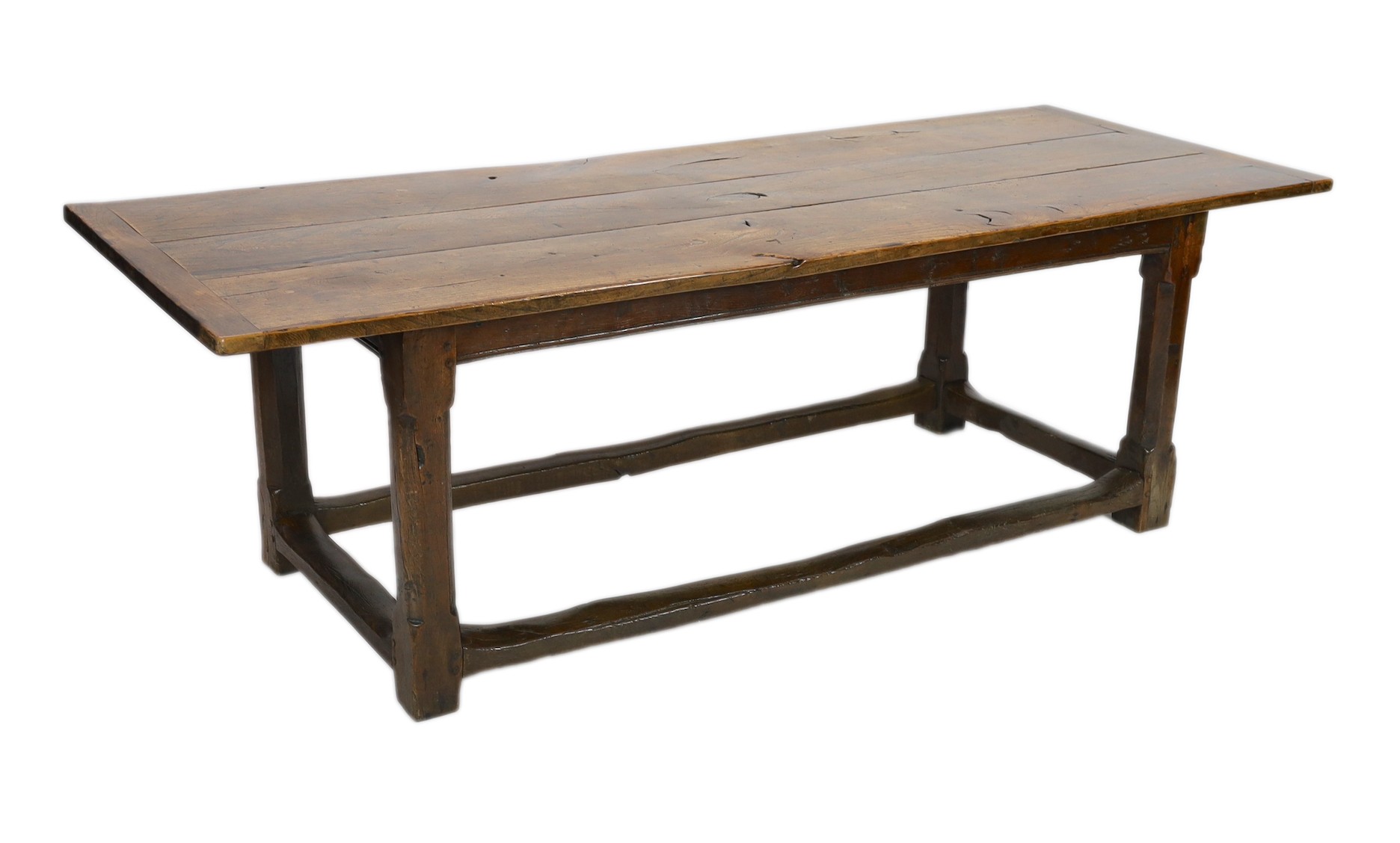 A late 17th / 18th century oak and elm refectory table, with triple planked top, on octagonal legs