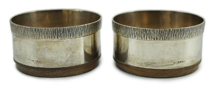 A pair of Elizabeth II silver wine coasters, by Graham Watling, with textured borders, London, 1986,