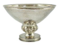 A George V Omar Ramsden planished silver pedestal bowl, with knopped stem, on circular foot, with