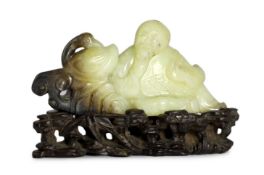 A Chinese white and black jade group of the calligrapher Wang Xizhi seated by a goose, 18th century,