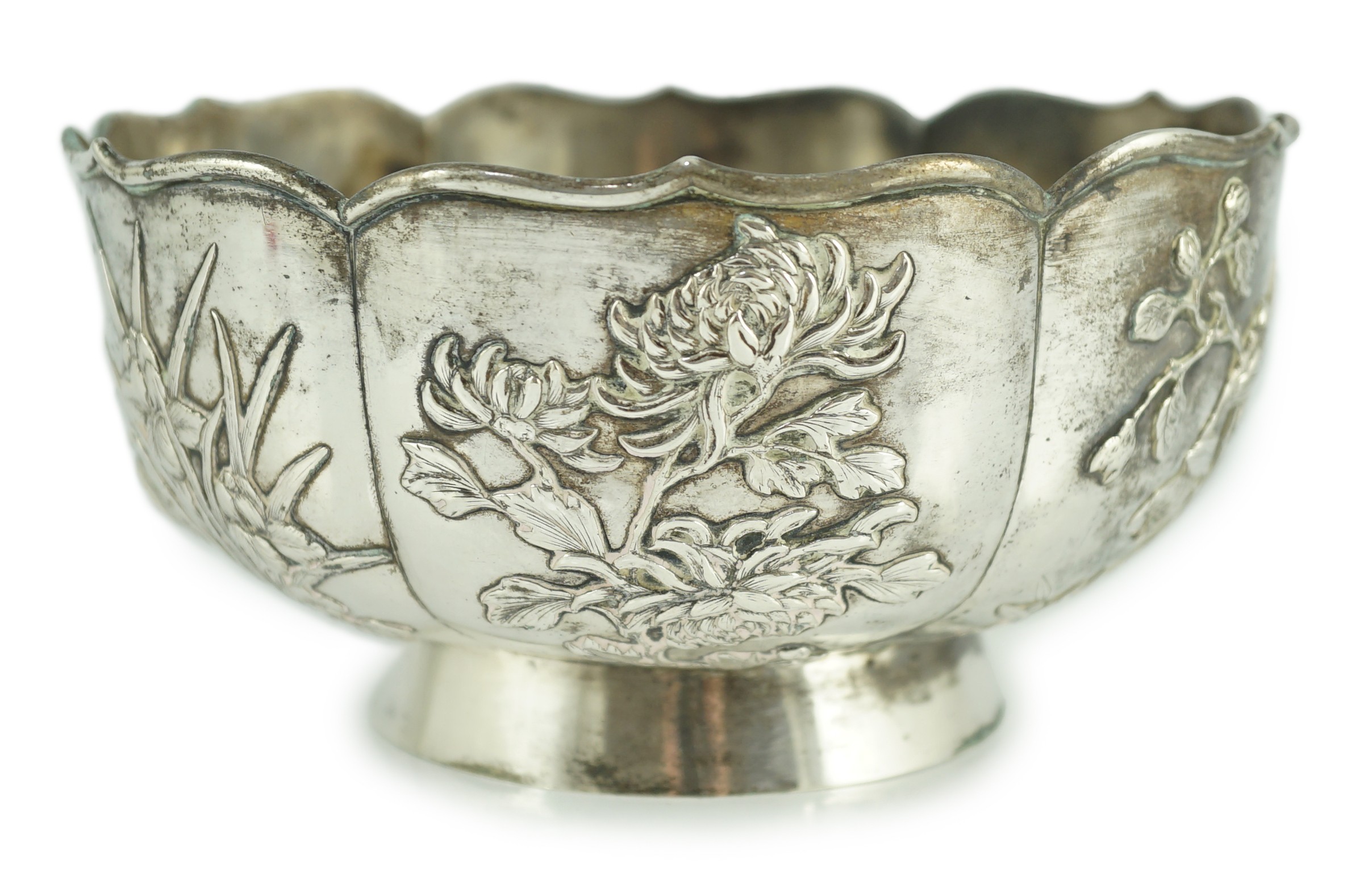 A late 19th century Chinese Export silver circular bowl, by Chong Woo, Hong Kong, applied with