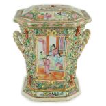 A Chinese Canton (Guangzhou) famille rose decorated bough pot and cover, c.1830, painted with