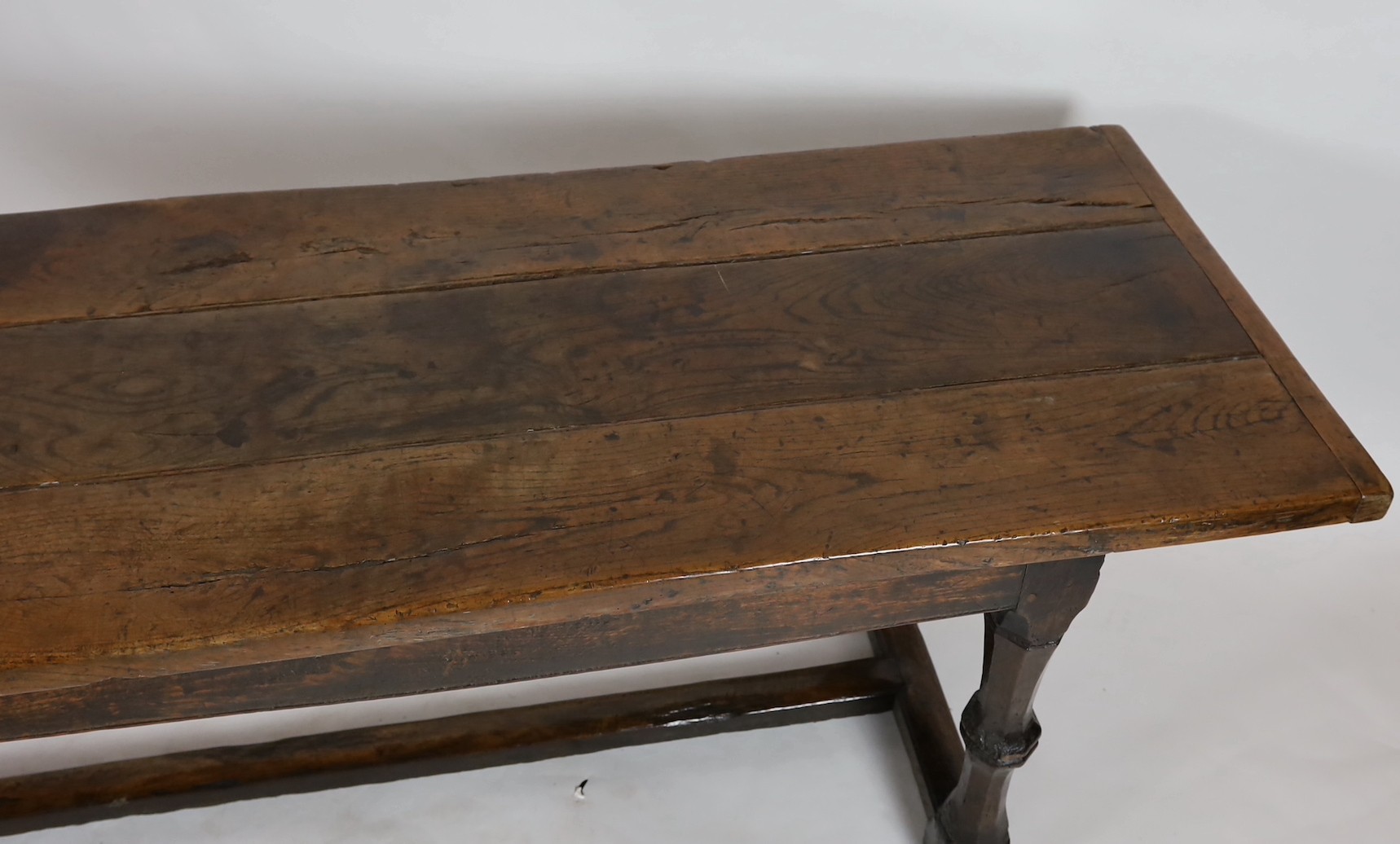 A Charles I oak refectory table, c.1630, the triple plank top with cleated ends, the four unusual - Image 2 of 4