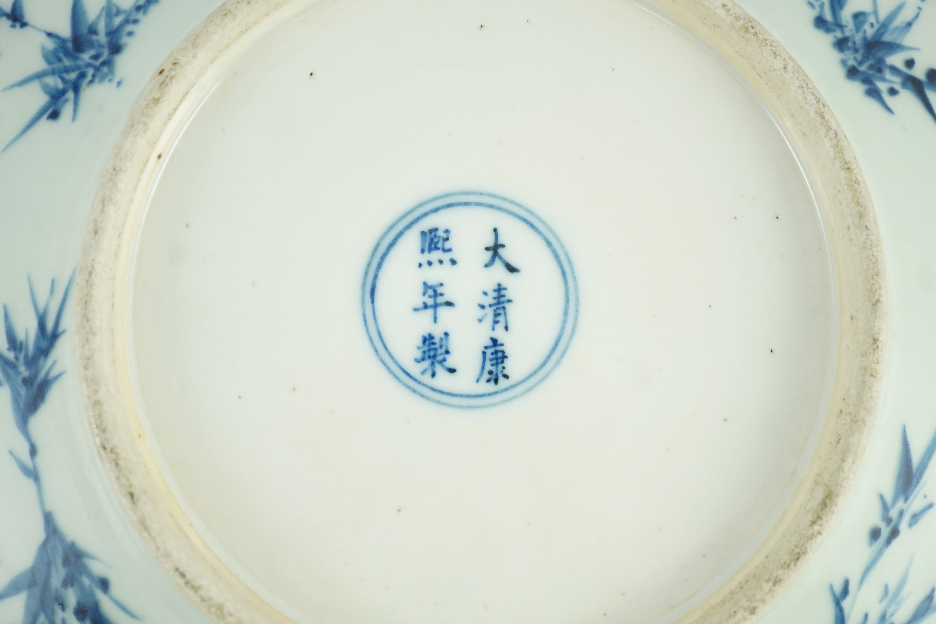 A Chinese blue and white dish, Kangxi mark, 19th century, the centre painted with four - Image 7 of 7