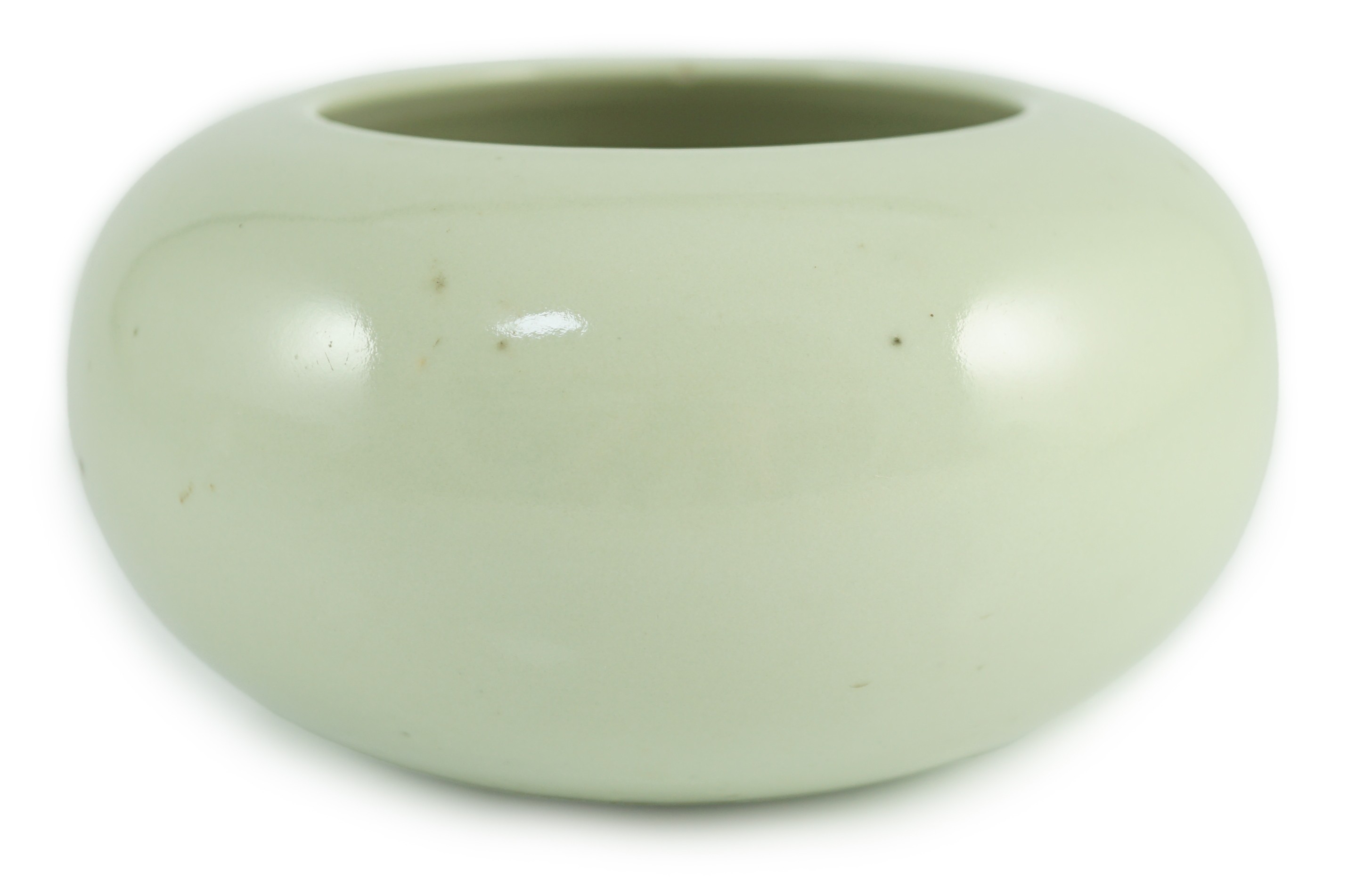 A Chinese celadon glazed water pot or alms bowl, late 19th century, with concave and unglazed
