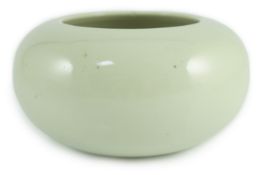 A Chinese celadon glazed water pot or alms bowl, late 19th century, with concave and unglazed