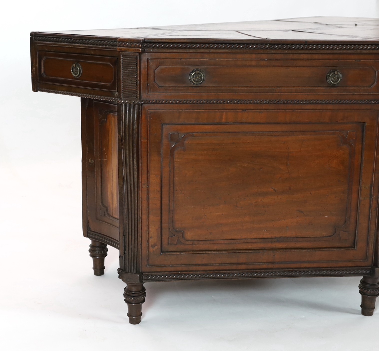 An unusual George IV mahogany kneehole desk, of demi-octagonal form, with segmented leather lined - Image 3 of 4