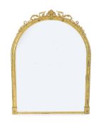 A Victorian giltwood and gesso overmantel mirror, of ornate arched form with foliate scroll and