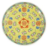 A Chinese yellow ground ‘peaches and bats’ dish, Republic period, enamelled with Shou medallions,