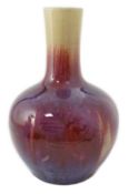 A Chinese flambe bottle vase, tianqiuping, 19th century, the mushroom coloured glaze of the neck