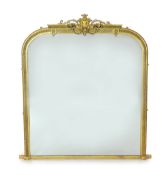 A Victorian giltwood and gesso overmantel mirror, of arched form with foliate scroll crest and