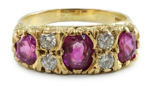 An early to mid 20th century 18ct gold, single stone oval cut ruby, two stone pink sapphire and four