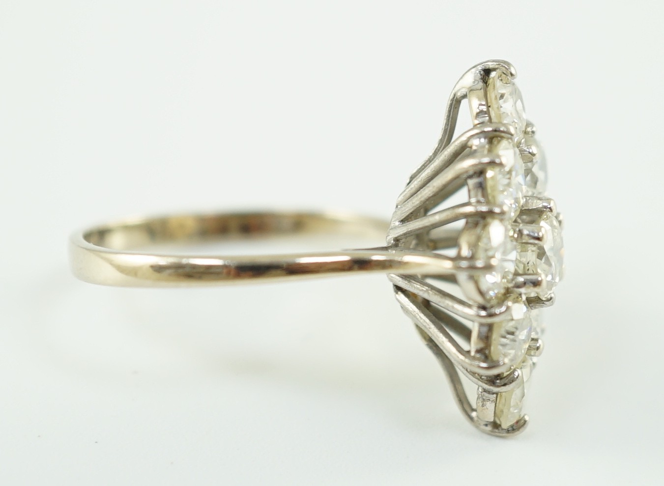 An 18ct white gold and nine stone diamond cluster set marquise shaped diamond ring, with a raised - Image 4 of 4