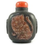 A Chinese two colour marble cameo ‘tiger’ snuff bottle, 19th century, of flattened oblong form,