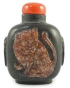 A Chinese two colour marble cameo ‘tiger’ snuff bottle, 19th century, of flattened oblong form,