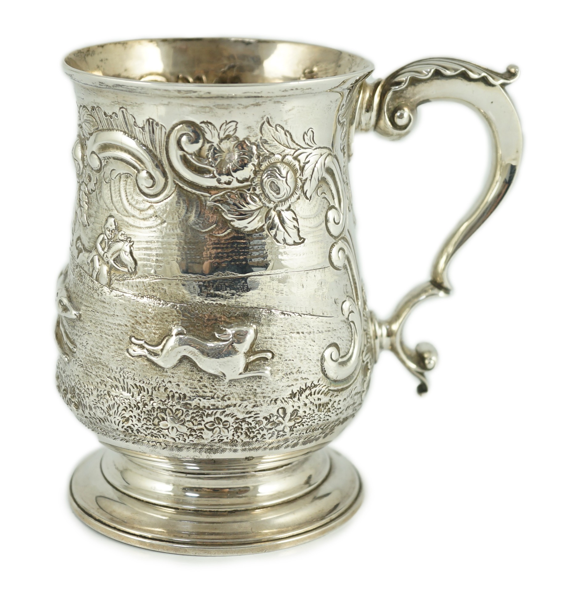 A George III silver baluster mug, later embossed with continuous hare coursing scene, John Scofield,