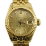 A lady's early 1980's 18ct gold Rolex Oyster Perpetual Datejust wrist watch, on 18ct gold Rolex