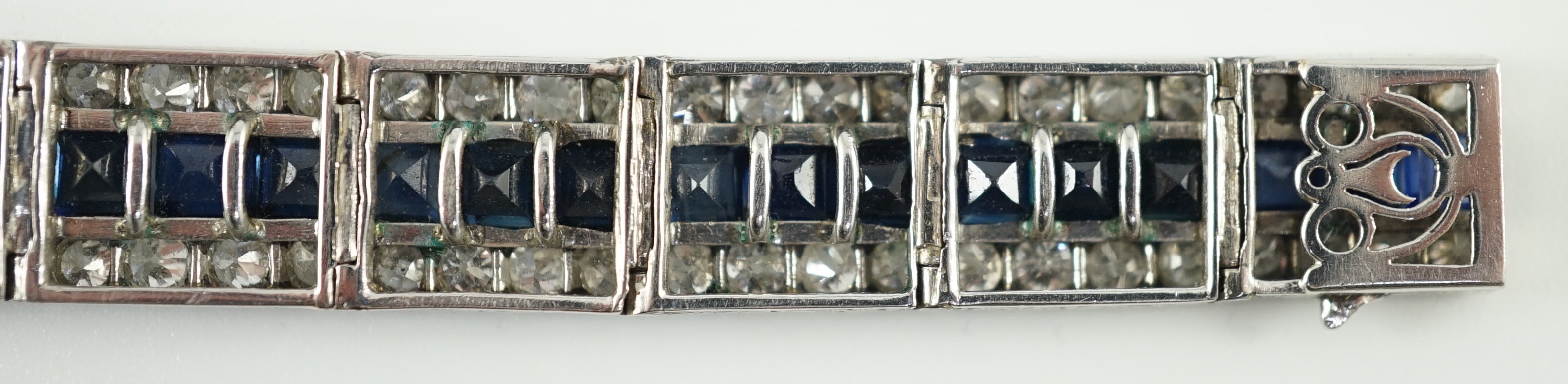 A 1920’s white gold, sapphire and diamond set triple line bracelet, with engraved setting and two - Image 8 of 9