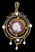 A Victorian gold, pearl, black enamel, and sardonyx hardstone cameo set drop pendant, the cameo