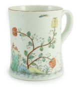 A rare Worcester polychrome 'flower and rockwork' small mug, c.1753-54, painted with rockwork,