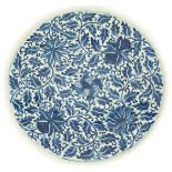 A Chinese blue and white dish, Kangxi mark, 19th century, the centre painted with four