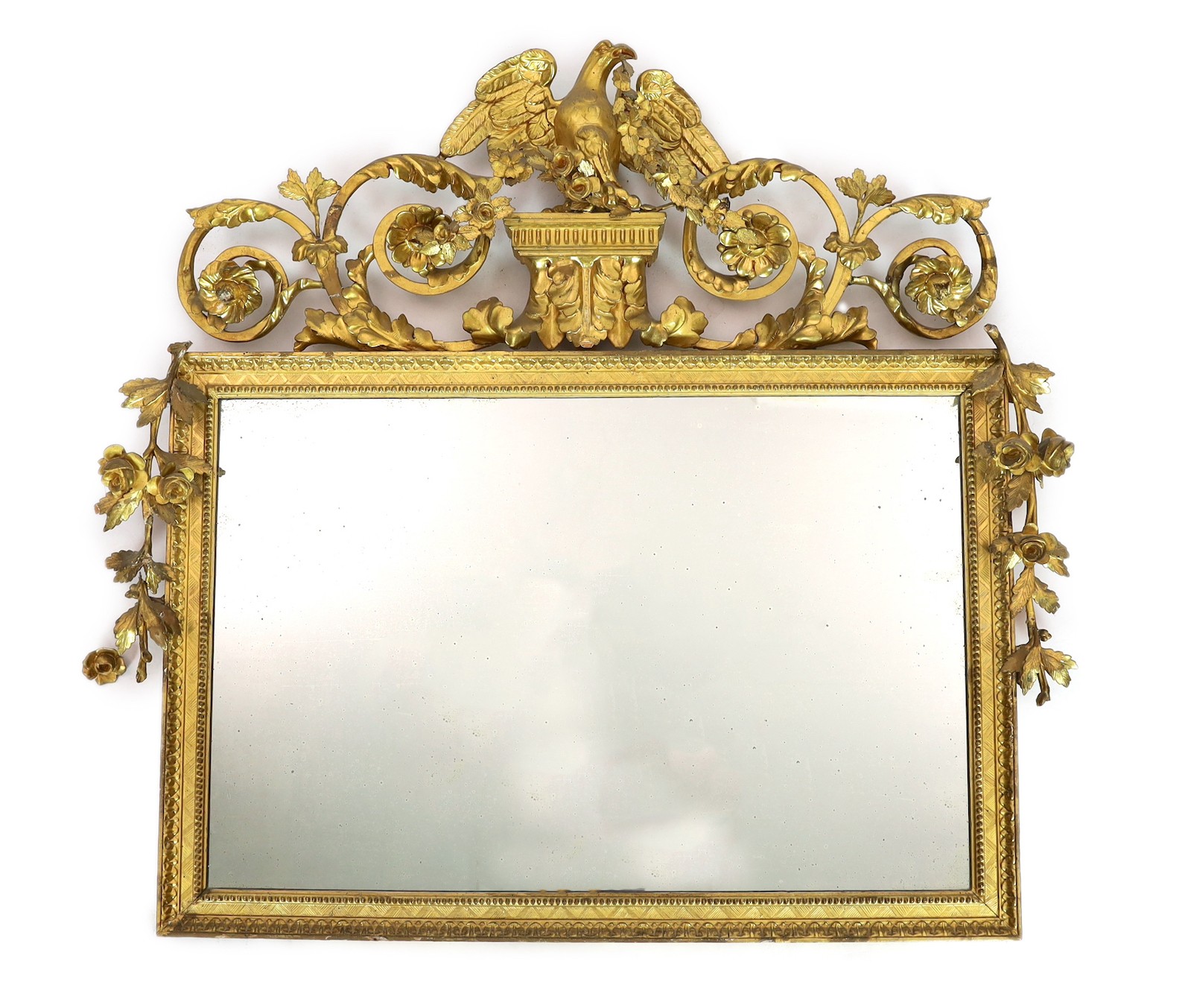 A 19th century century carved giltwood wall mirror, with elaborate ornate eagle and flowering swag