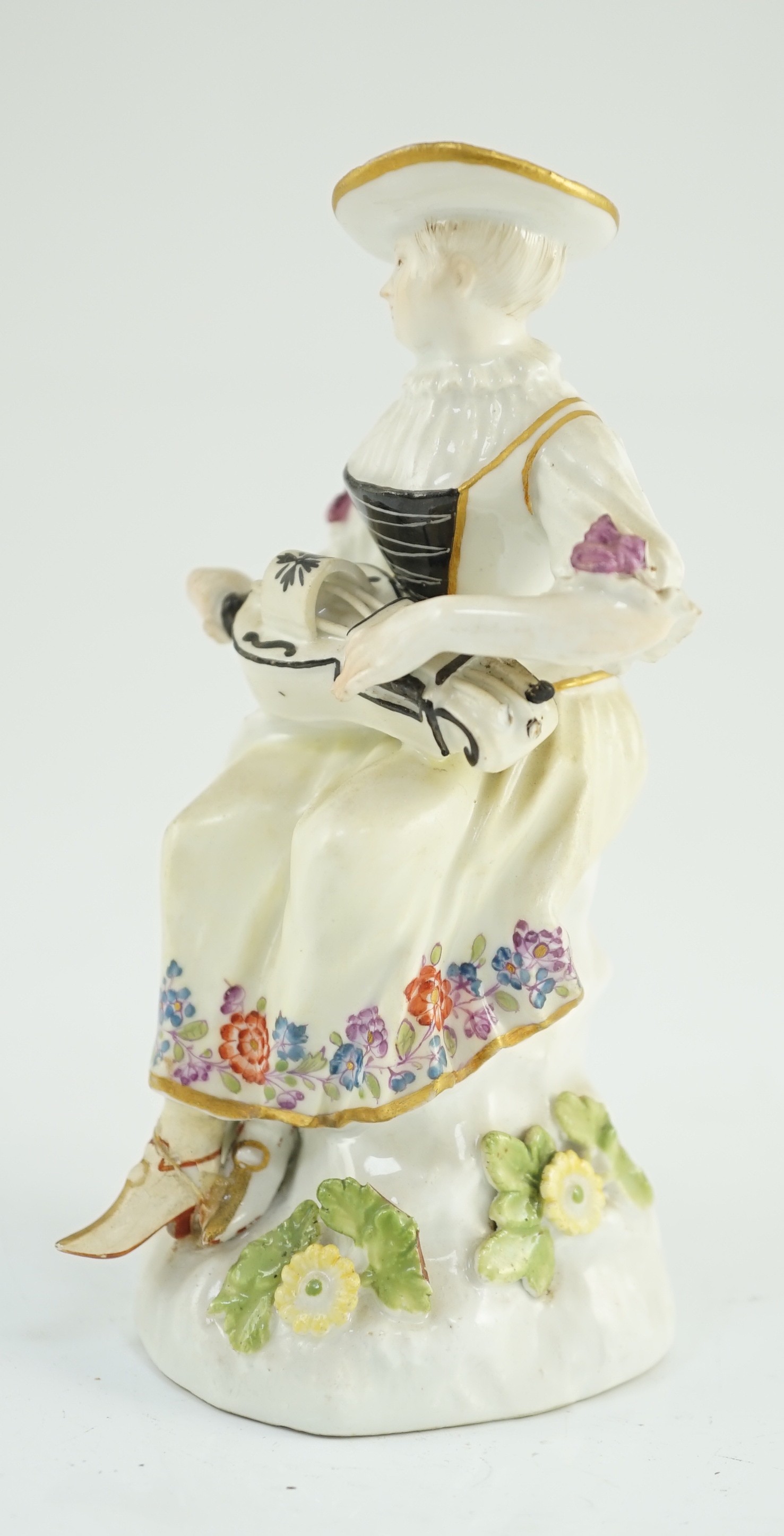 A Meissen porcelain figure of a woman playing the hurdy gurdy, mid 18th century, possibly modelled - Image 3 of 6