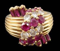 An early 1960's Kutchinsky 18ct gold ruby and diamond cluster set dress ring, with reeded shank