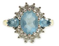 A 1970's 18ct gold, aquamarine and diamond set oval cluster ring, by Cropp & Farr, set with three
