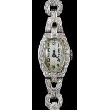 A lady's 1920’s platinum and round brilliant cut diamond set manual wind cocktail watch, on a