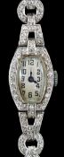 A lady's 1920’s platinum and round brilliant cut diamond set manual wind cocktail watch, on a