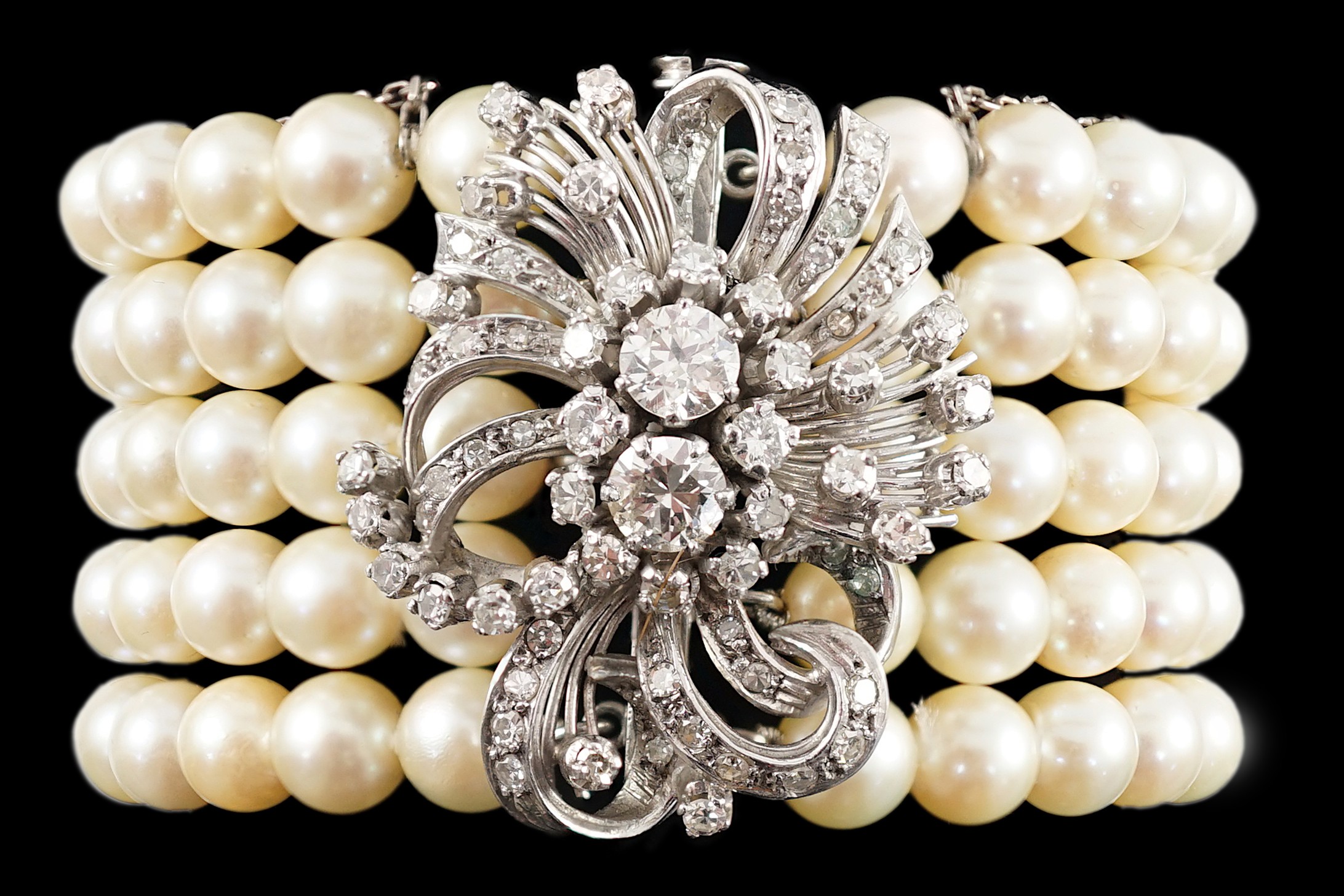 A mid to late 20th century continental quintuple strand cultured pearl bracelet, with white gold and