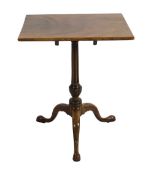A George III mahogany tripod table, with tilting rectangular top, on spiral fluted baluster stem