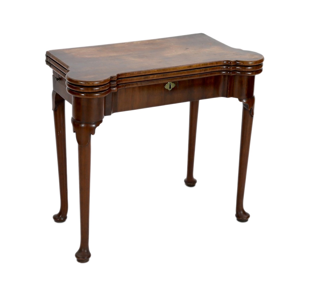 A George II mahogany games table, with eared triple folding top opening to reveal a baize surface