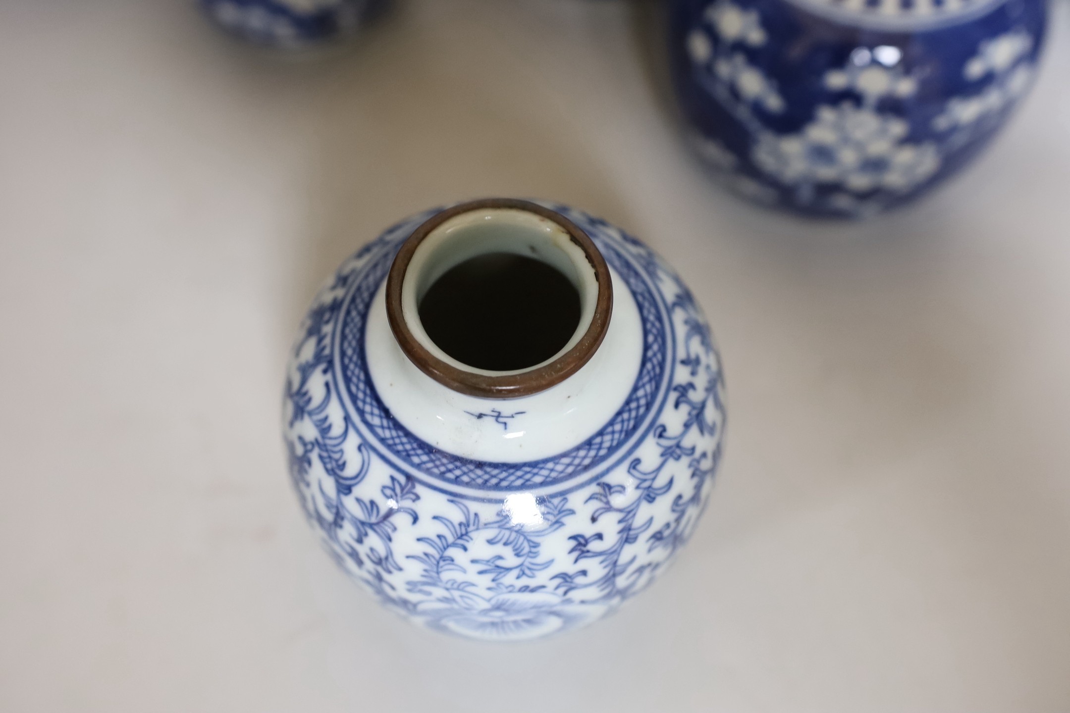 Four Chinese blue and white prunus pattern ginger jars, together with three similar vases. 19th/ - Image 3 of 10