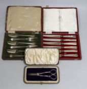 A cased set of Edwardian silver grape shears, Sheffield, 1901 and two other cased sets including