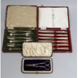 A cased set of Edwardian silver grape shears, Sheffield, 1901 and two other cased sets including