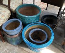 Six assorted circular glazed earthenware garden planters, largest diameter 47cm, height 47cm