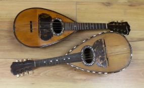 Two mandolins, with mother of pearl and tortoiseshell inlay, 57ms long, bone mounts