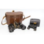 A cased set of Ross binoculars and a smaller cased set for racing