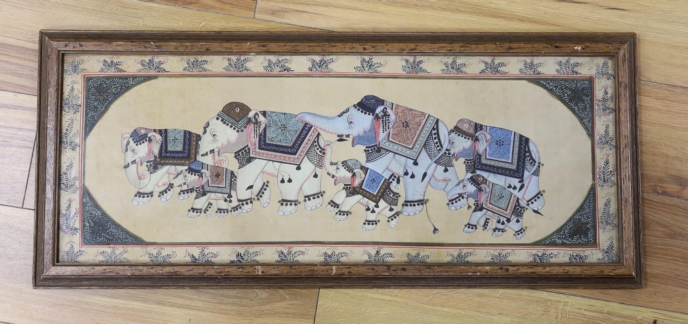 An Indian watercolour on silk, elephants, framed.