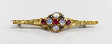 An early 20th century, yellow metal, moonstone, ruby and green garnet cluster set bar brooch,