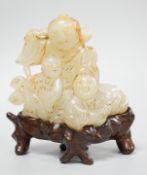 A Chinese white and russet jade group of three boys, 18th/19th century, Provenance - the former